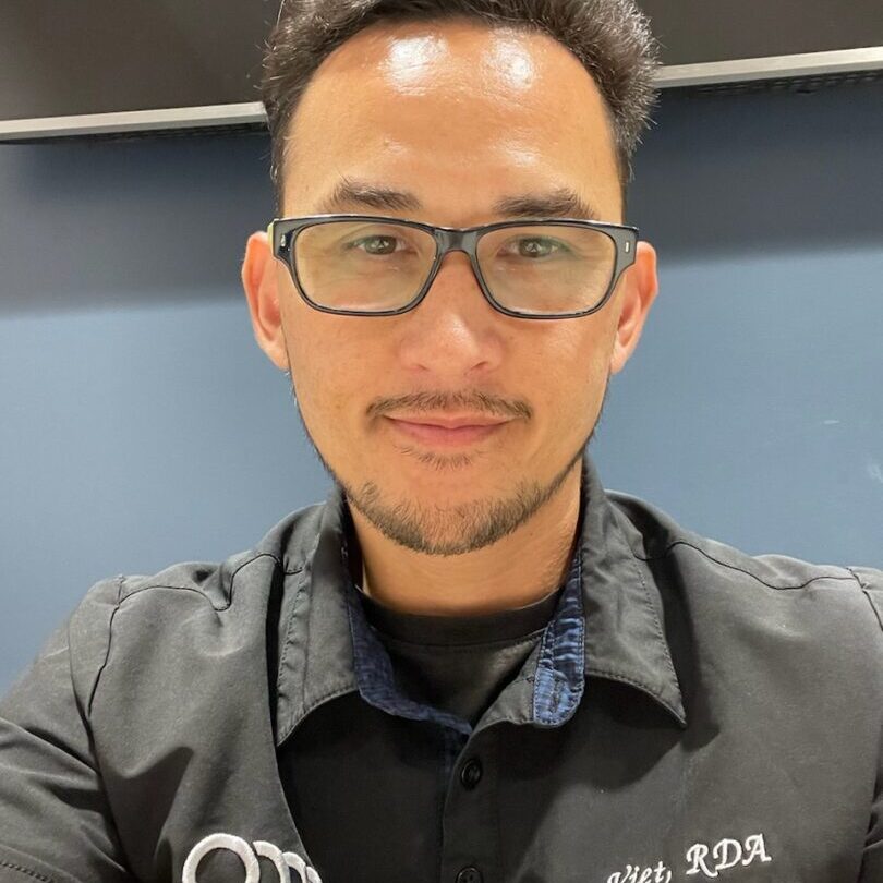A man with glasses and black shirt
